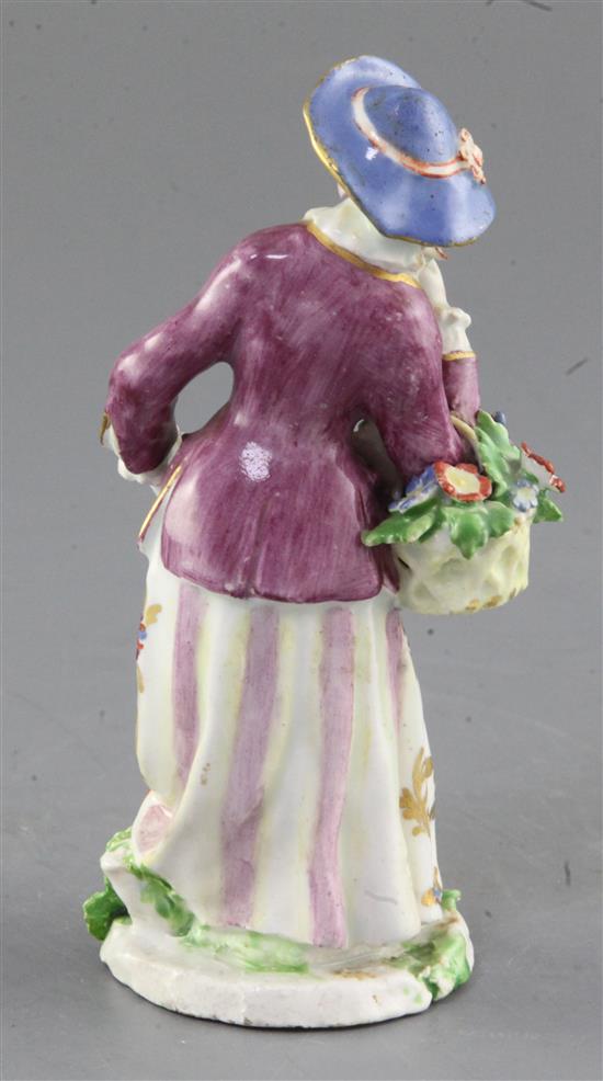 A Bow porcelain figure of a lady seller, c.1765, height 14.6c,